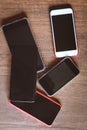 Many mobile phones on the wooden table