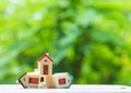 Model house falling on floor and nature background