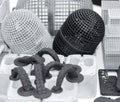 Many models printed on 3D printer. Gray and black objects printed 3D printer.