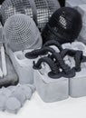 Many models printed on 3D printer. Gray and black objects printed 3D printer. Royalty Free Stock Photo