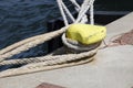 Many mooring ropes on one yellow mooring bollard Royalty Free Stock Photo