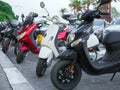 Many mopeds and scooter motorcycles. Royalty Free Stock Photo