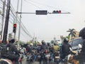 Many motorcyclists are stopping at traffic lights