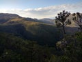 mountains, forest and blue sky with clouds