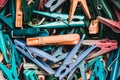 Many multi-colored clothespins close-up as a background