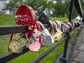 Many multi-colored padlocks on the bridge. Royalty Free Stock Photo