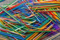 many multi-colored plastic tubes for cocktail on Colored background, top view Royalty Free Stock Photo