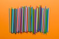 many multi-colored plastic tubes for cocktail on Colored background, top view Royalty Free Stock Photo