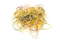 Many multi-colored rubber bands for money on a white background, isolate. Stationery concept