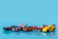 Many multi-colored toy cars on blue background Royalty Free Stock Photo