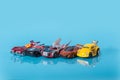 Many multi-colored toy cars on blue background Royalty Free Stock Photo