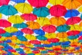 Many multi-colored umbrellas hanging Royalty Free Stock Photo