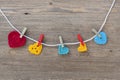 Many multicolor crochet hearts on wooden background for Valentines day
