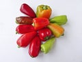Many multicolored bell peppers isolated