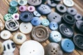 Many multicolored buttons on a brown background Royalty Free Stock Photo