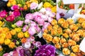 Many multicolored fresh peonies bouquets background. Dutch flower market stall or store. Wholesale warehouse and Royalty Free Stock Photo