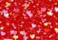 Many multicolored hearts on red background