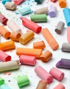 Many multicolored pastel crayons on a white background Royalty Free Stock Photo
