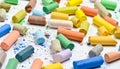 Many multicolored pastel crayons on a white background. Royalty Free Stock Photo