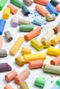 Many multicolored pastel crayons on a white background Royalty Free Stock Photo