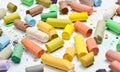 Many multicolored pastel crayons on a white background. Royalty Free Stock Photo