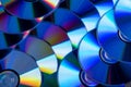 Many musical compact discs with a rainbow spectrum of colors as a bright background Royalty Free Stock Photo