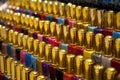 Many nail polish multicolor bottles arranged in rows background