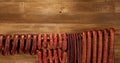 Many natural sausage hanged on wooden stick Royalty Free Stock Photo