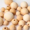 Many natural wooden balls on white