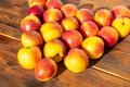 Many nectarines on a wooden background Royalty Free Stock Photo