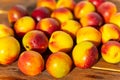 Many nectarines on a wooden background Royalty Free Stock Photo