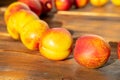 Many nectarines on a wooden background Royalty Free Stock Photo