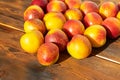 Many nectarines on a wooden background Royalty Free Stock Photo