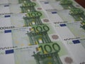 Many new 100 Euro banknotes are neatly arranged in rows Royalty Free Stock Photo