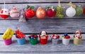 Many New Year's toys on a wooden background. Royalty Free Stock Photo