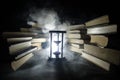 Many old books in a stack. Knoledge concept. Books on a dark background with smoke elements. Bewitched book in center