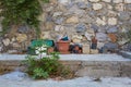 Many old dirty flower pots stand near a stone wall in the backyard Royalty Free Stock Photo