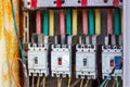 Many old rusty electrical fuse boxes with electic cables Royalty Free Stock Photo