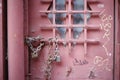 Many old rusty locks on a red metal urban door Royalty Free Stock Photo