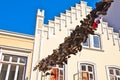 Many old shoes hanging on a string between two houses, a practice of students, who finished their studies in Flensburg / Germany Royalty Free Stock Photo