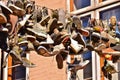Many old shoes hanging on a string between two houses, a practice of students, who finished their studies in Flensburg / Germany