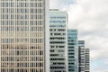 Many old tall office buildings in a row with cloudy sky. Royalty Free Stock Photo