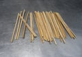 Many old traditional chopsticks put on metal table to desiccation