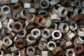 Many old used screw-nuts background, dark shining nuts Size 16mm