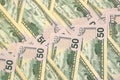 Many one hundred and fifty dollar bills on flat background surface close up. Flat lay top view