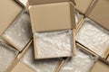 Many open cardboard boxes with bubble wrap on white wooden background, flat lay. Packaging goods Royalty Free Stock Photo