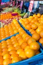 Many oranges in crates on market