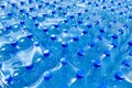 Many packaged blue mineral water bottles Royalty Free Stock Photo