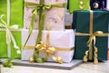 Many Packed boxes with gifts in green, beige and gold colors. large stack of Christmas presents. christmas holidays Royalty Free Stock Photo