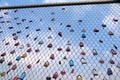 Many padlocks of lovers hanging on bridge railings